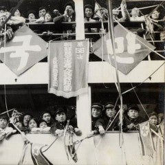 Koreans look down from the decks of the ship returning them to North Korea from Japan