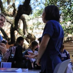 Asian Studies staff member speaks with interested student