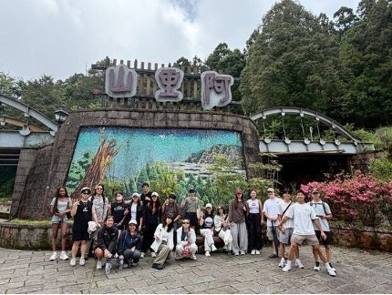 Students in front of a mural