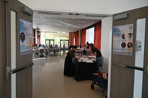 TAAADS Symposium attendees registering at check-in desk