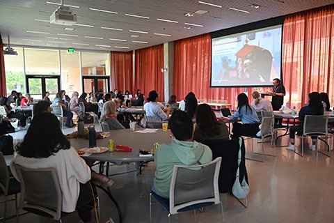 TAAADS Symposium presenter and attendees during conference session