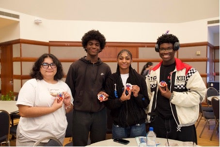 Students presenting their dough figurines